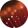 Close up on the ends of many illuminated red fiber optic strands with black background  Focus on foreground 