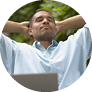 Man relaxing with eyes closed and hands behind head